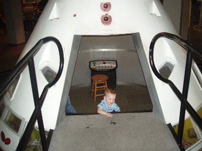 climbing out of the Apollo Command Module Test Vehicle