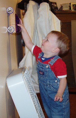 Hayden driving a car up the wall